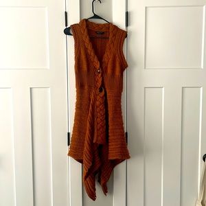 BCBG Max Azria asymmetrical sleeveless sweater.  Burnt Orange.  Size medium.